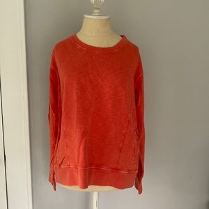 Made to look sun faded pretty peachy orange Orvis sweatshirt